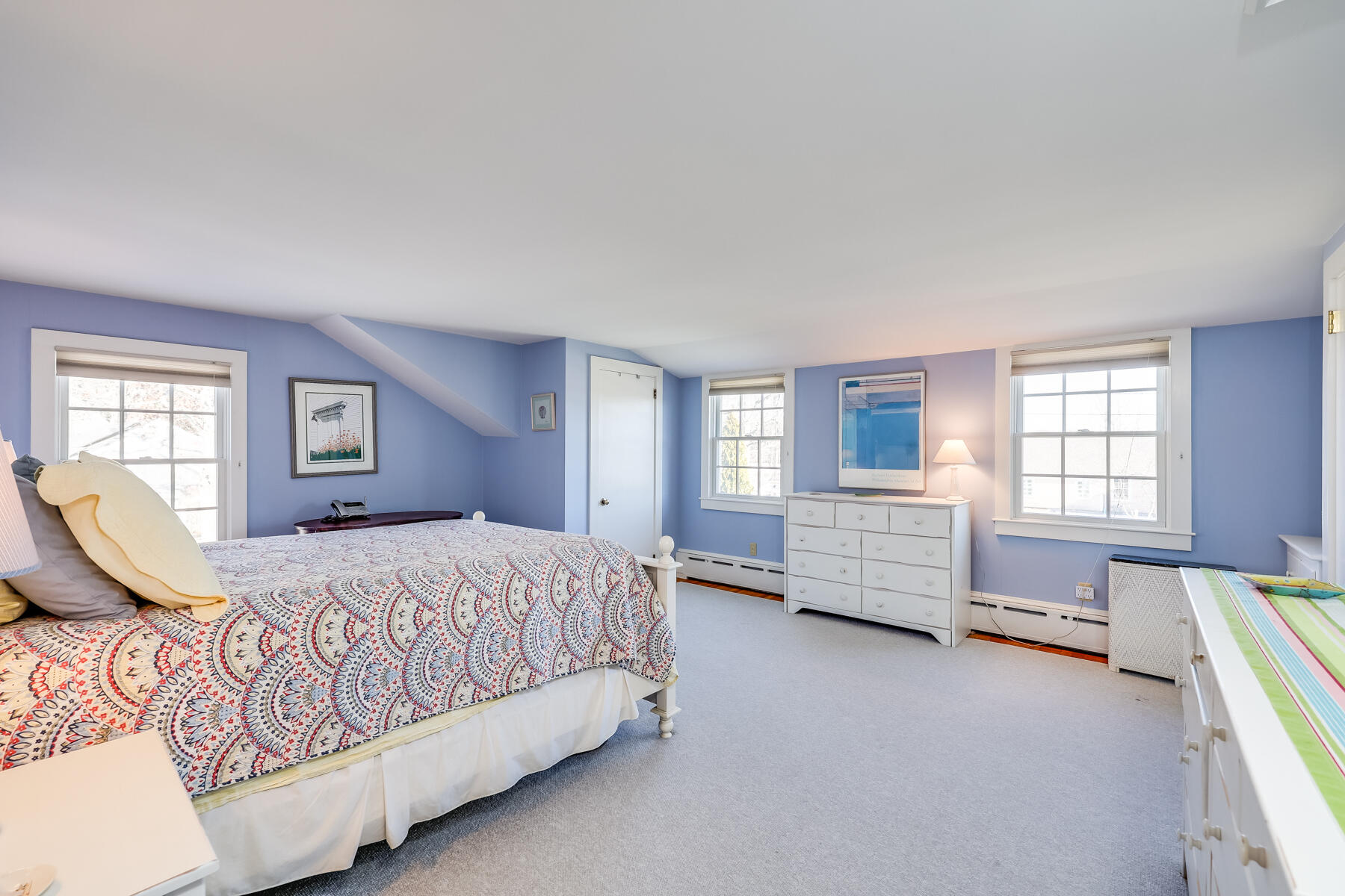 87 First Avenue Hyannis Port, MA 02601 - Photo 17 of 29 a spacious bedroom with a bed and a couch