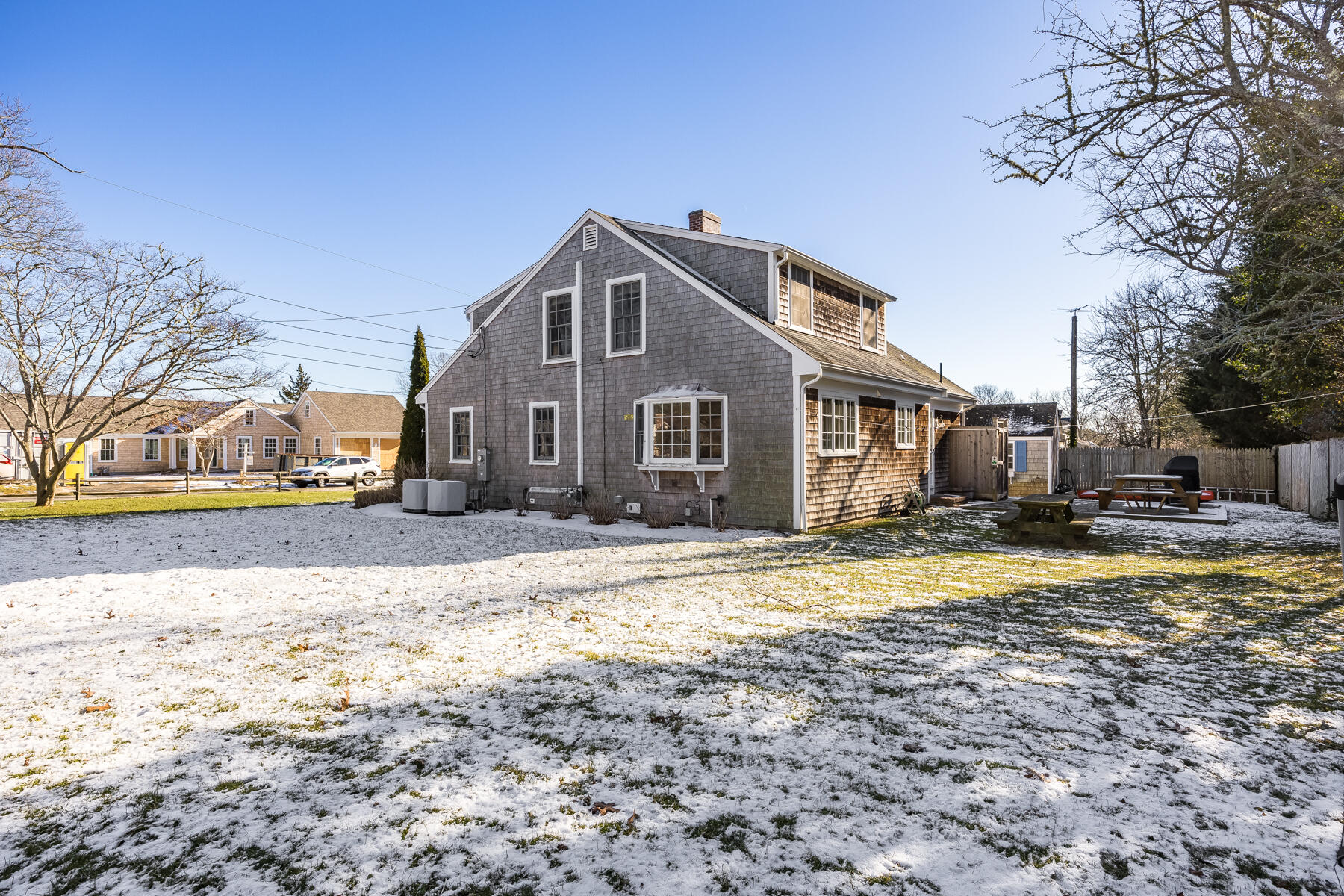 87 First Avenue Hyannis Port, MA 02601 - Photo 26 of 29 a view of a house with a yard covered in snow