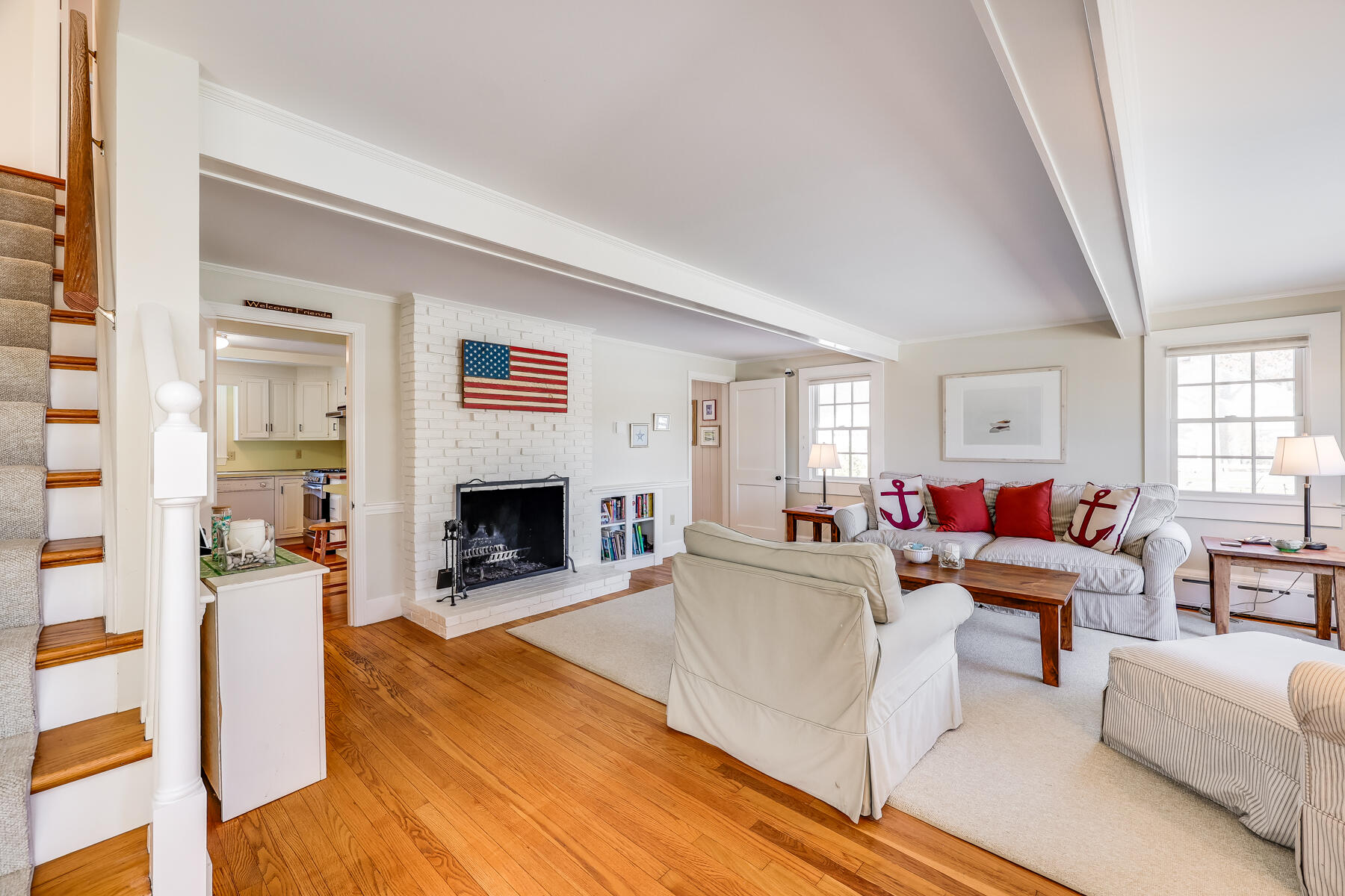 87 First Avenue Hyannis Port, MA 02601 - Photo 4 of 29 a living room with furniture a fireplace and a large window