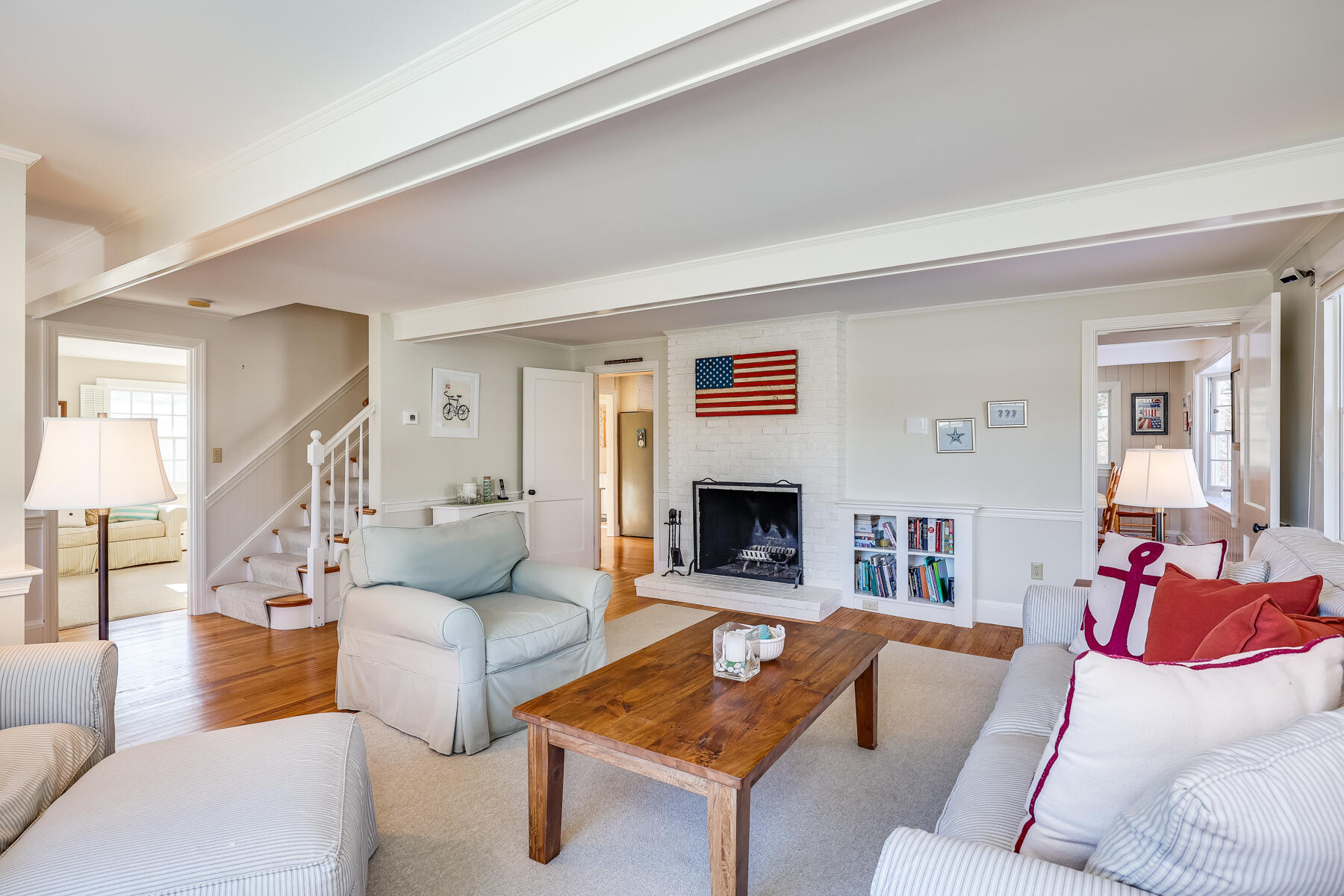 87 First Avenue Hyannis Port, MA 02601 - Photo 7 of 29 a living room with furniture and a fireplace