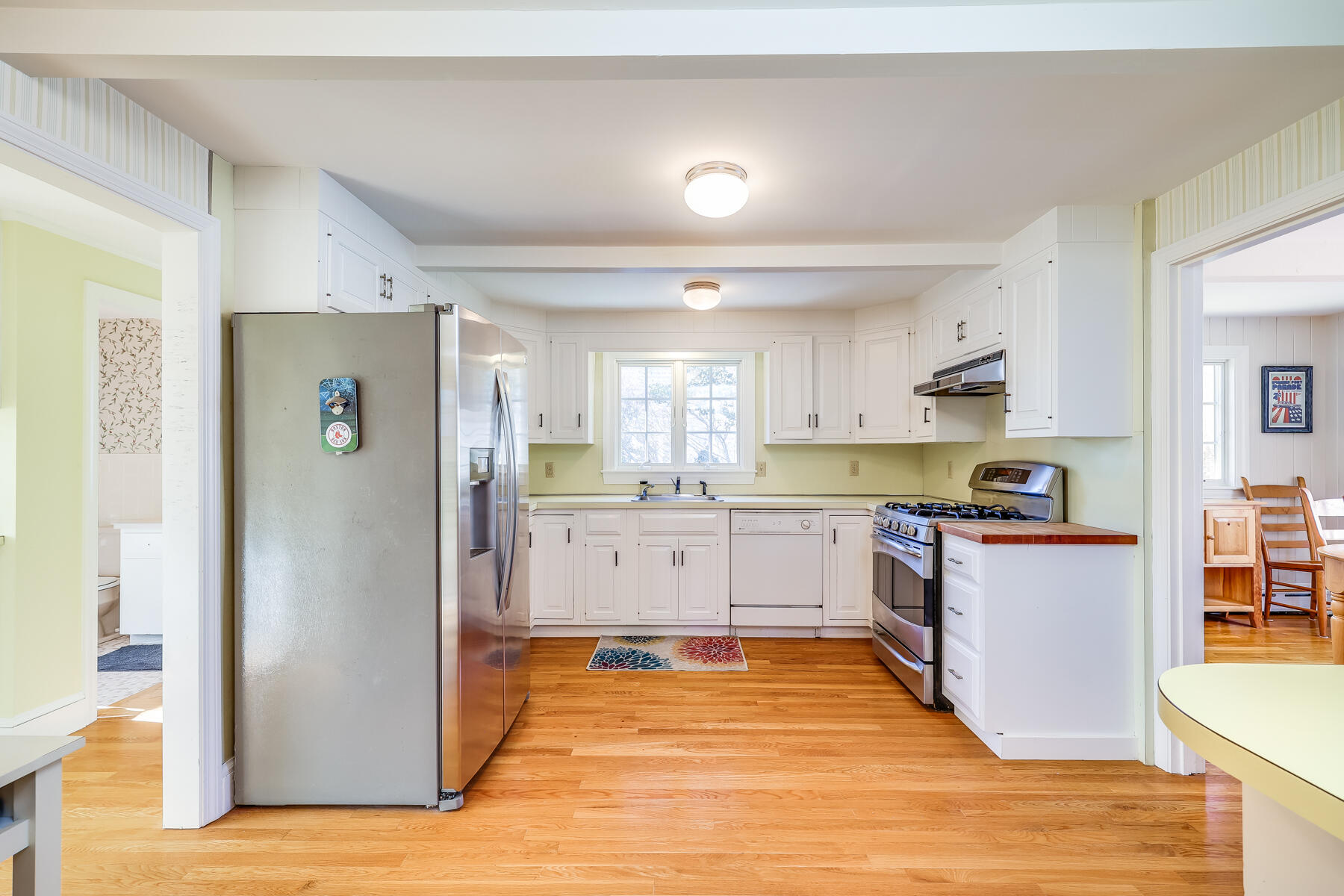 87 First Avenue Hyannis Port, MA 02601 - Photo 10 of 29 a kitchen with stainless steel appliances a refrigerator and a stove top oven