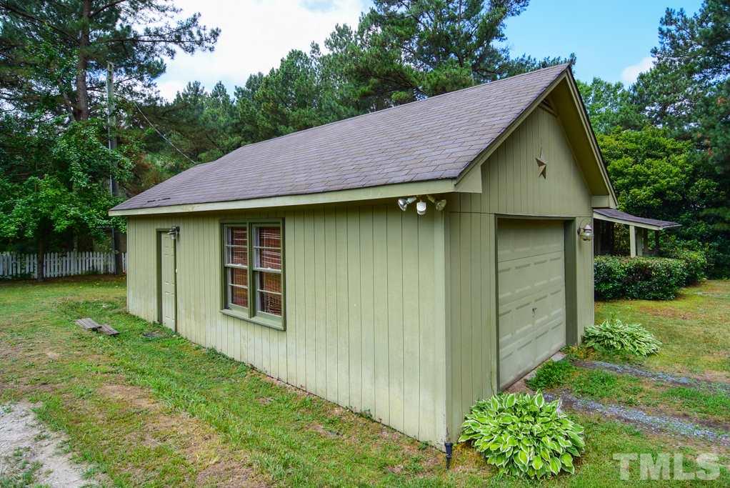 One car garage with giant space for tools and workshop.