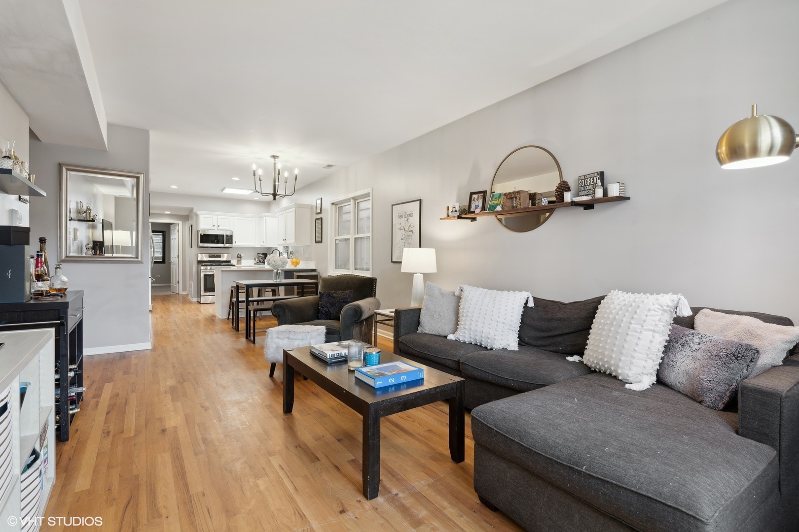 825 South Miller Street, Unit 2 Chicago, IL 60607 - Photo 3 of 15 a living room with furniture and a wooden floor