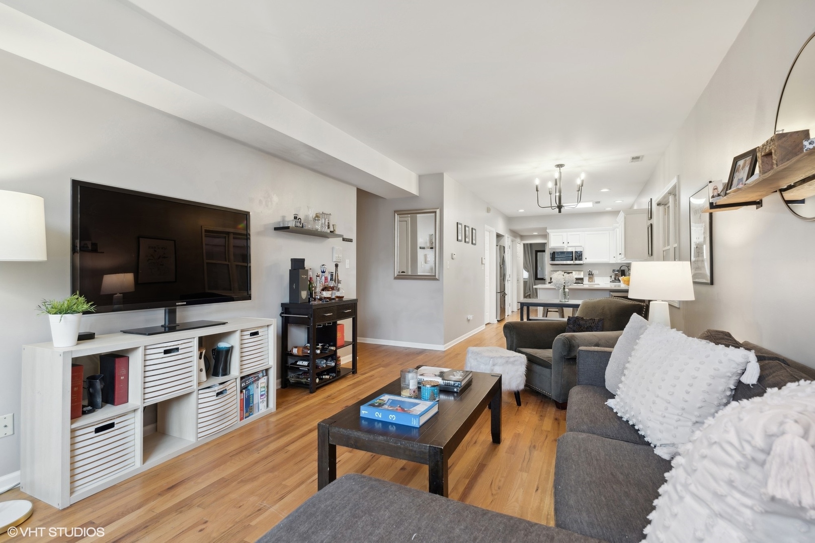 825 South Miller Street, Unit 2 Chicago, IL 60607 - Photo 4 of 15 a living room with furniture and a flat screen tv