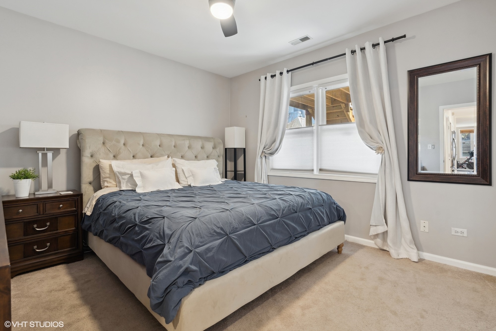 825 South Miller Street, Unit 2 Chicago, IL 60607 - Photo 10 of 15 a large bed sitting in a bedroom next to a window