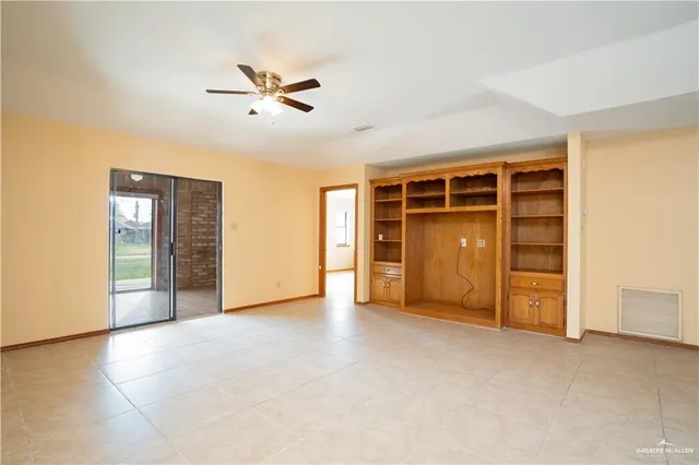a view of an empty room with a closet