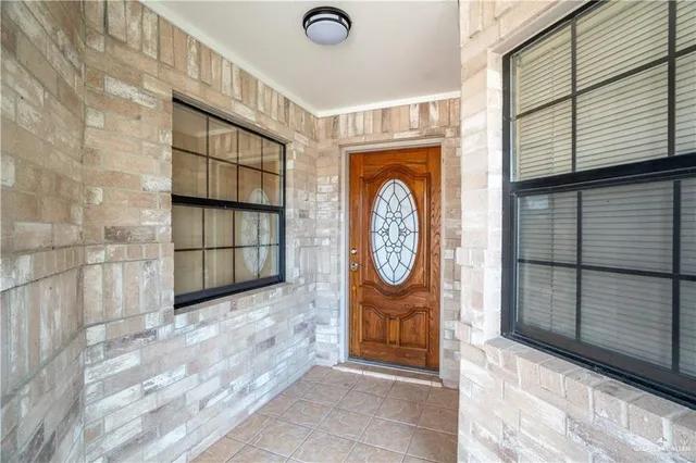 a view of a hallway with washer and dryer