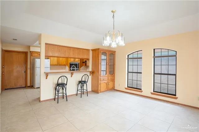 a view of a livingroom with furniture and chandelier