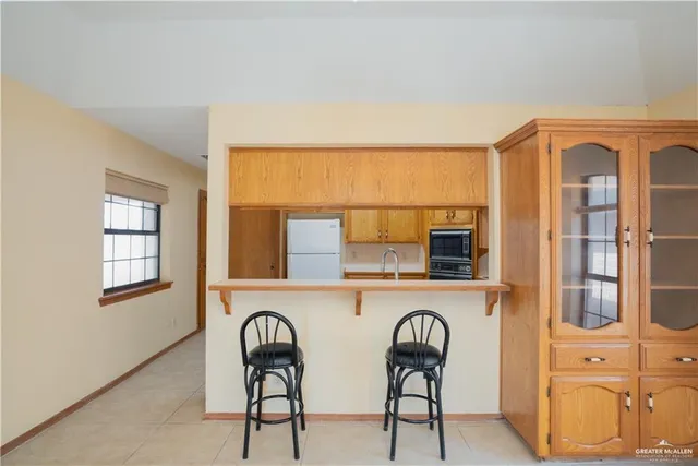 a view of a kitchen area with furniture and window
