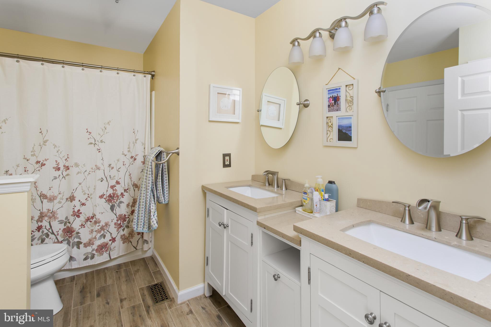 25 Springcress Drive Delran, NJ 08075 - Photo 31 of 44 a bathroom with a double vanity sink mirror and shower