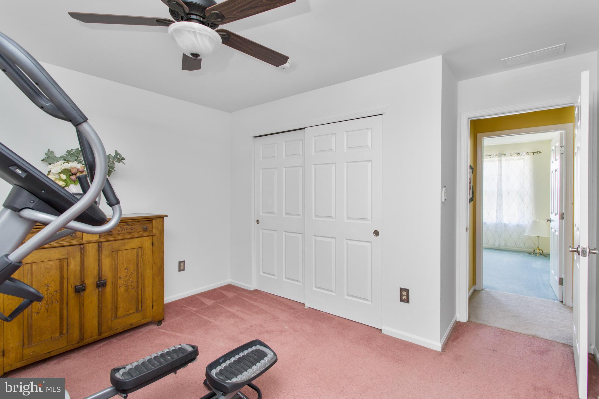 25 Springcress Drive Delran, NJ 08075 - Photo 35 of 44 a view of a livingroom with wooden floor and a ceiling fan