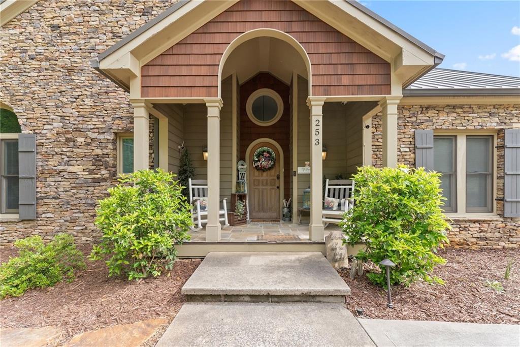 253 Happy Trails Way Jasper, GA 30143 - Photo 59 of 97 a front view of a house with garden