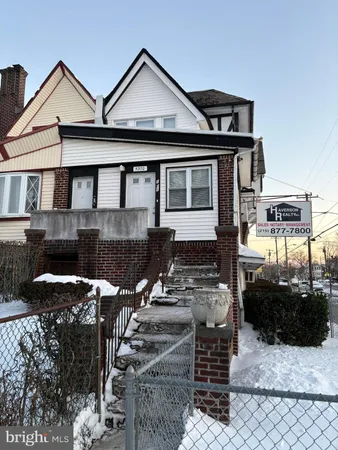 a front view of a house with parking space