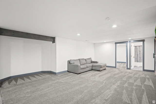 1588 West Rim Rock Drive Stockton, UT 84071 - Photo 28 of 61 Spacious room featuring light gray patterned carpeting, white walls, and recessed lighting