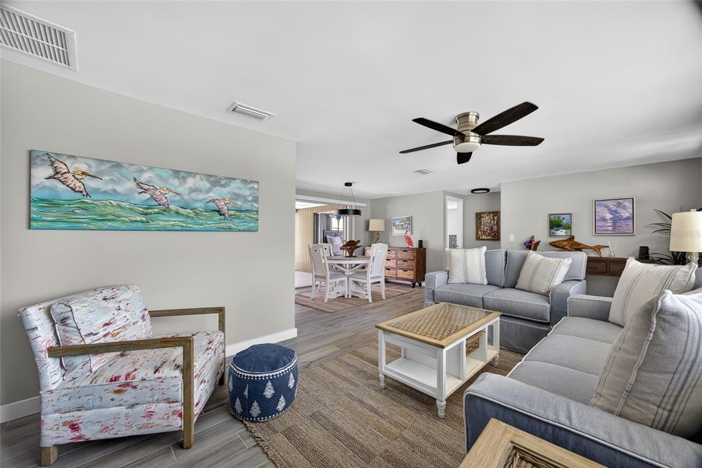 6035 Manasota Key Road Englewood, FL 34223 - Photo 12 of 54 a living room with furniture and a large window