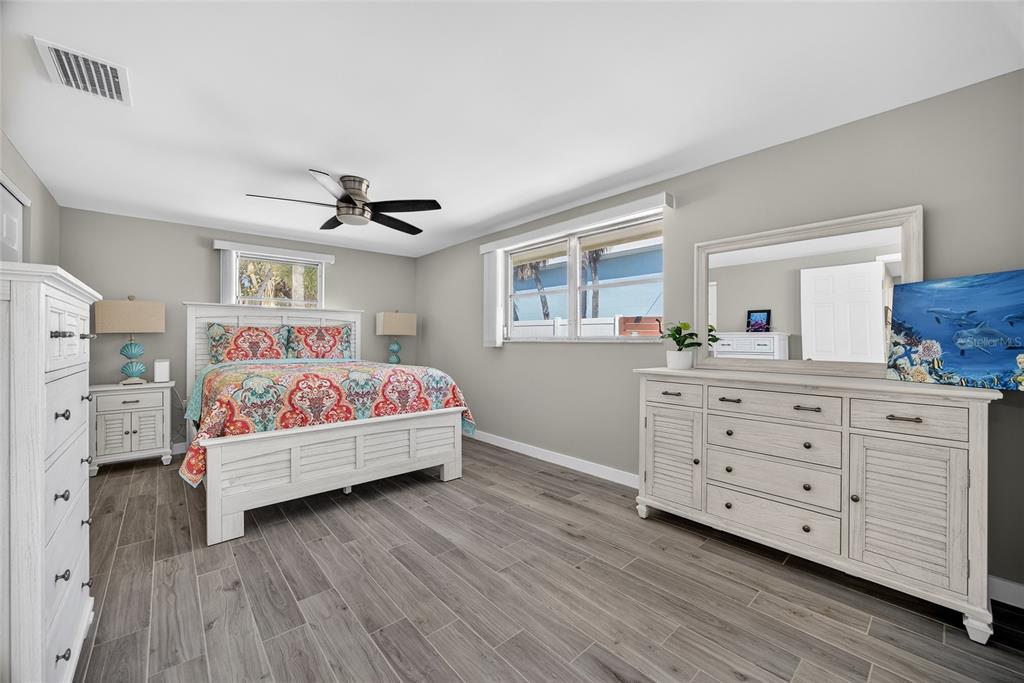 6035 Manasota Key Road Englewood, FL 34223 - Photo 24 of 54 a bedroom with a bed and a dresser