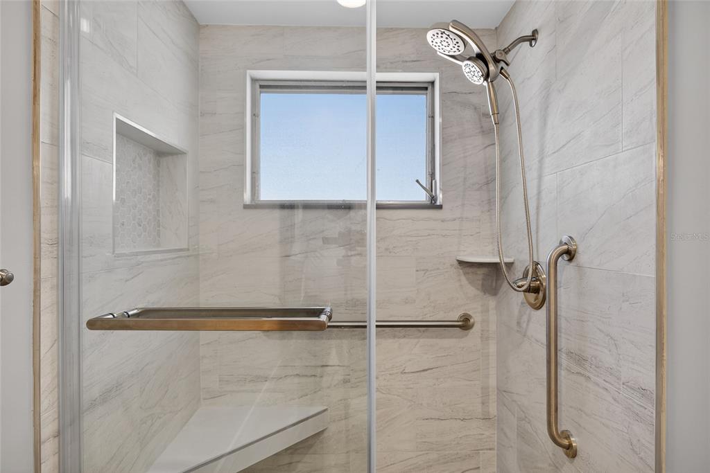 6035 Manasota Key Road Englewood, FL 34223 - Photo 27 of 54 a bathroom with a shower