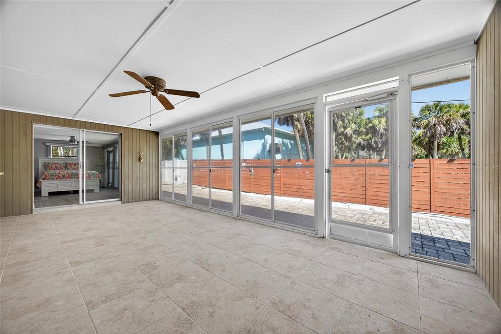 6035 Manasota Key Road Englewood, FL 34223 - Photo 28 of 54 a view of an empty room with glass door