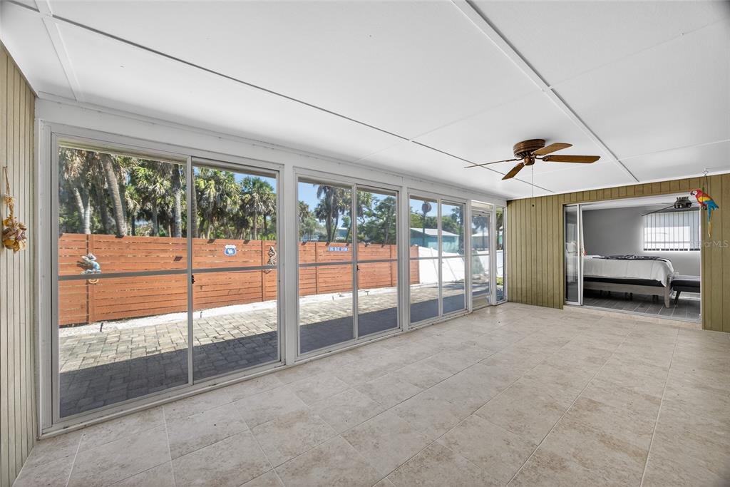 6035 Manasota Key Road Englewood, FL 34223 - Photo 29 of 54 a view of an empty room with sliding door