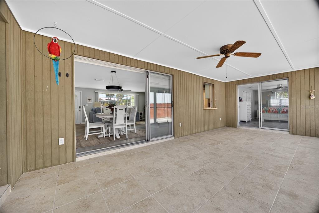 6035 Manasota Key Road Englewood, FL 34223 - Photo 31 of 54 a view of a livingroom with furniture and a ceiling fan