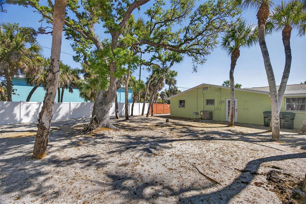 6035 Manasota Key Road Englewood, FL 34223 - Photo 34 of 54 a view of a house with a yard