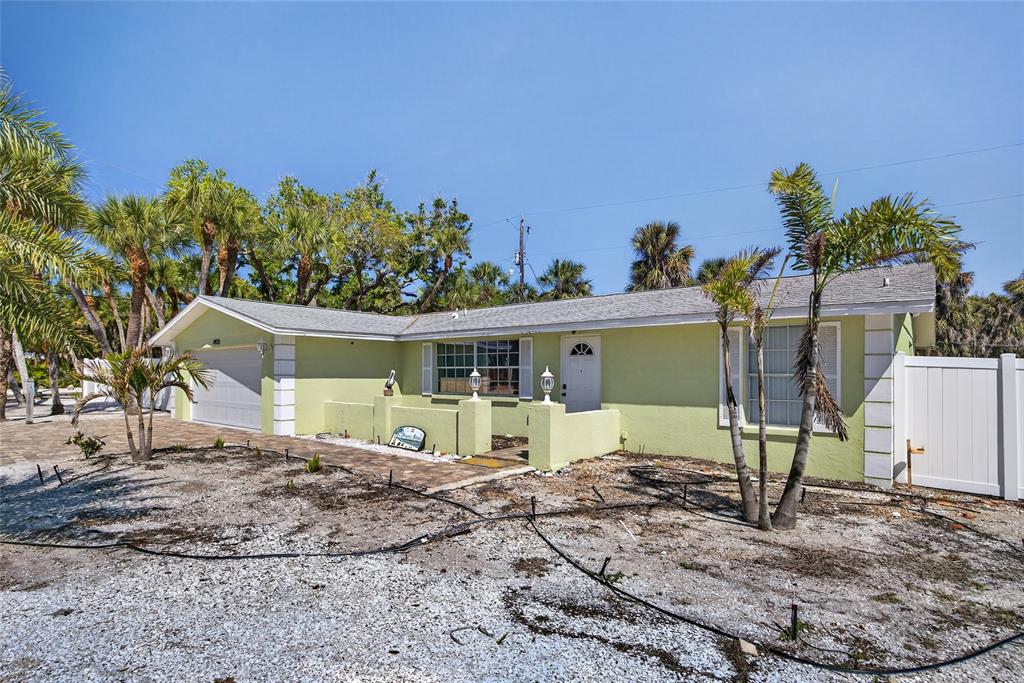 6035 Manasota Key Road Englewood, FL 34223 - Photo 52 of 54 a view of a house with a yard