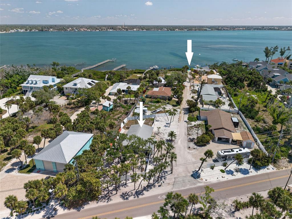 6035 Manasota Key Road Englewood, FL 34223 - Photo 7 of 54 an aerial view of a house with a lake view
