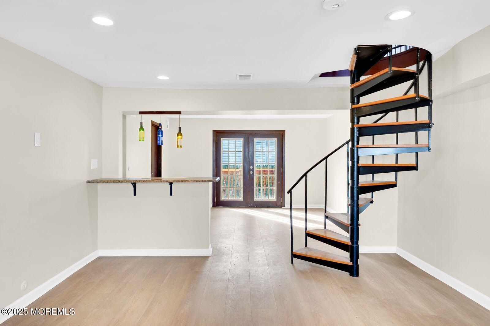 32 Lakewood Avenue Keansburg, NJ 07734 - Photo 7 of 30 an entryway in a hall with a window and a ceiling fan
