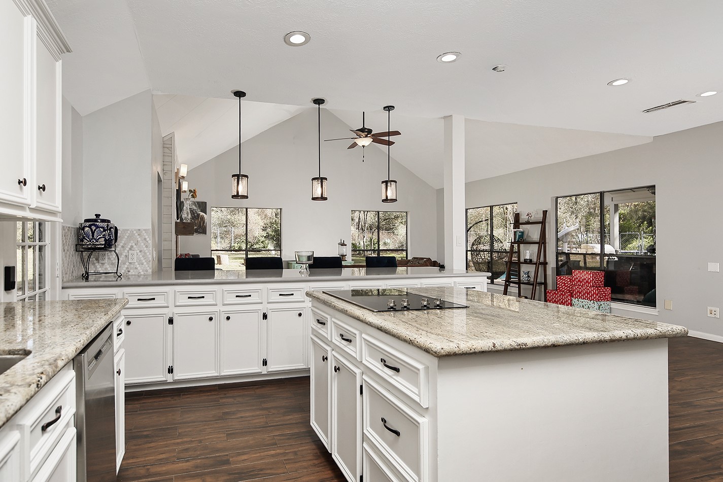 44 Lake Forest Circle Conroe, TX 77384 - Photo 12 of 49 a kitchen with stainless steel appliances granite countertop a sink stove and cabinets