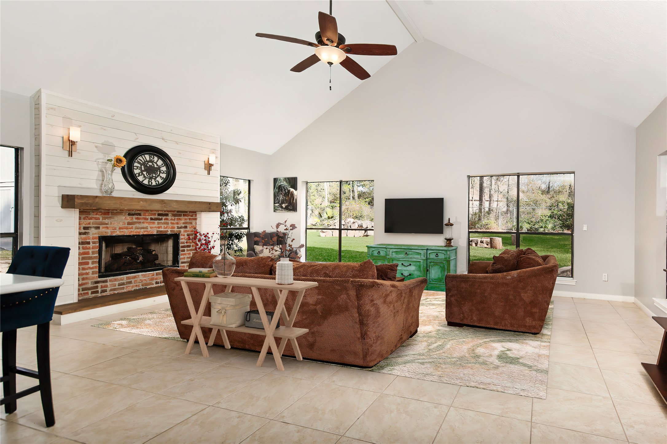 44 Lake Forest Circle Conroe, TX 77384 - Photo 14 of 49 a living room with furniture a flat screen tv and a fireplace