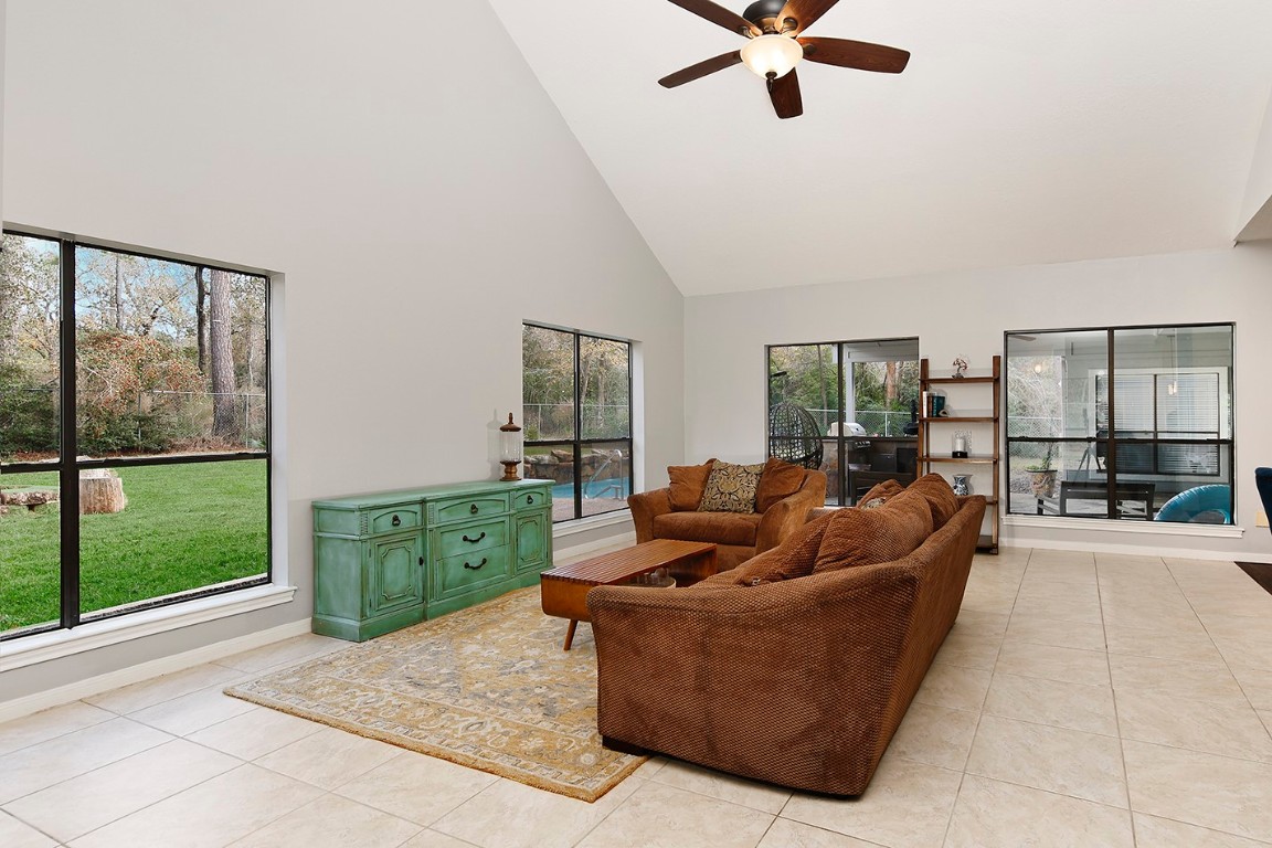 44 Lake Forest Circle Conroe, TX 77384 - Photo 16 of 49 a living room with furniture and a large window