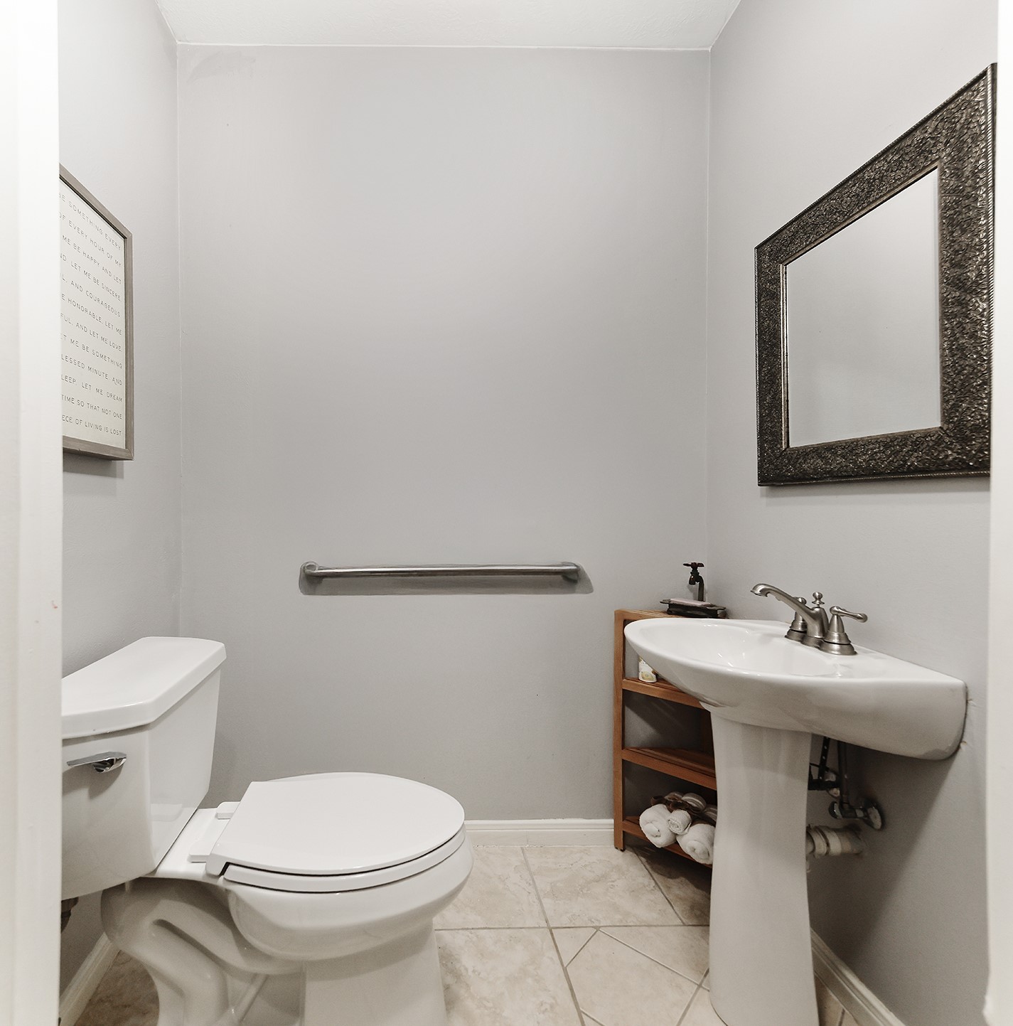 44 Lake Forest Circle Conroe, TX 77384 - Photo 17 of 49 a bathroom with a toilet sink and mirror