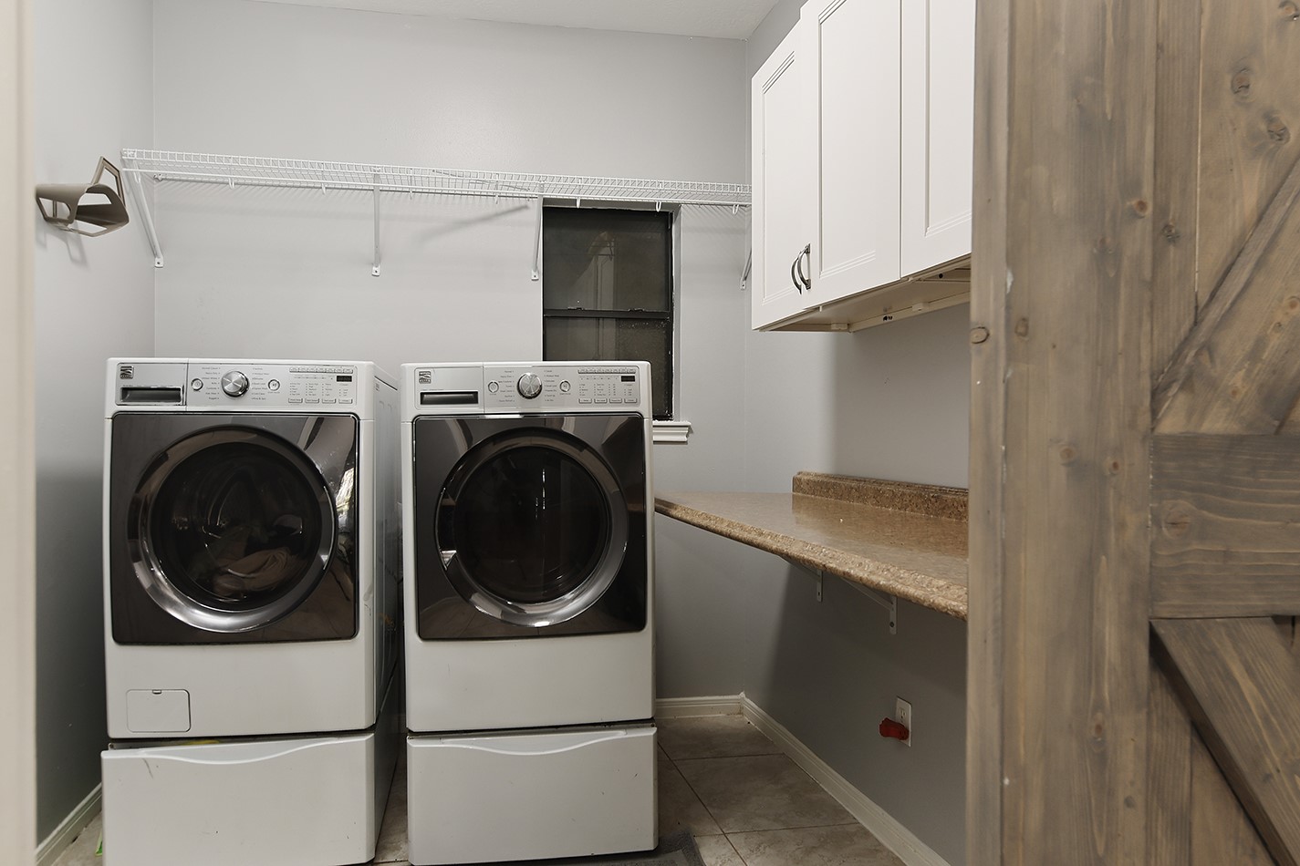 44 Lake Forest Circle Conroe, TX 77384 - Photo 19 of 49 a utility room with dryer and washer