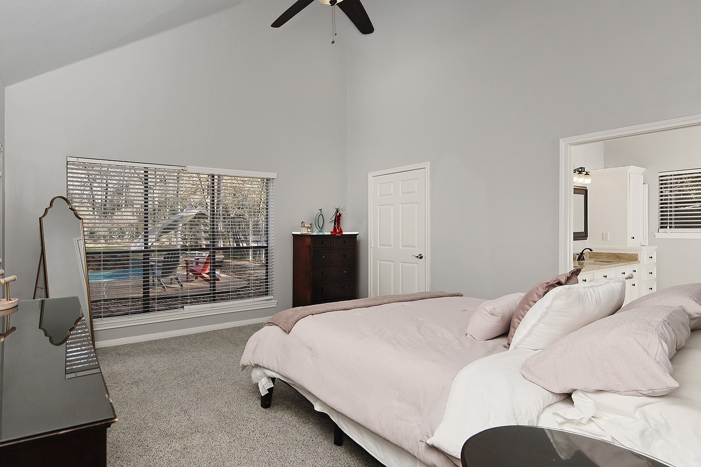 44 Lake Forest Circle Conroe, TX 77384 - Photo 20 of 49 a bedroom with a bed and glass door