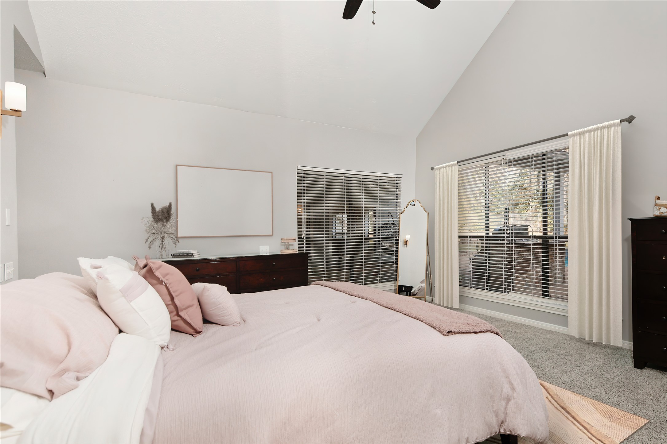 44 Lake Forest Circle Conroe, TX 77384 - Photo 23 of 49 a bedroom with a large bed and a large window