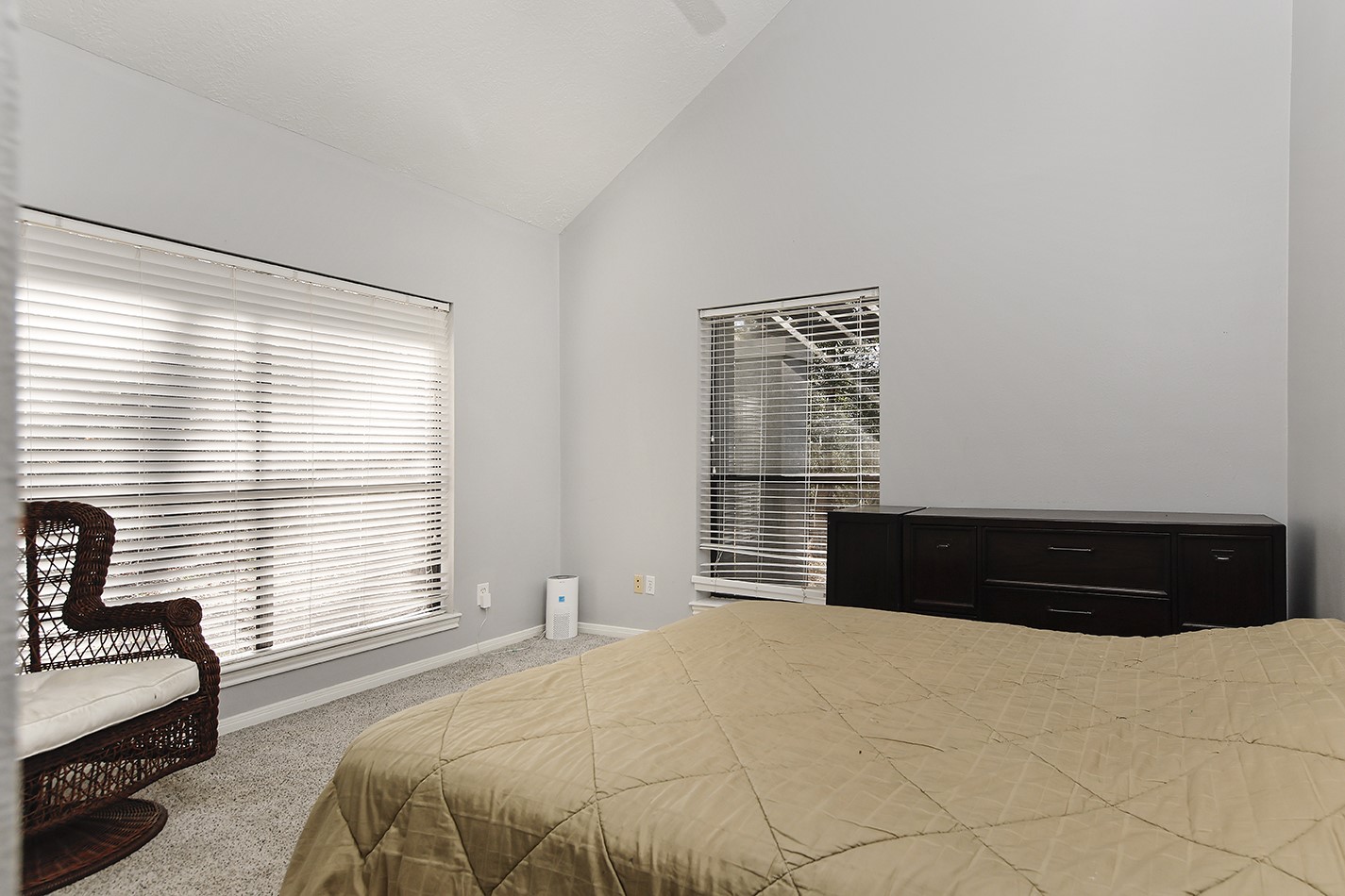 44 Lake Forest Circle Conroe, TX 77384 - Photo 31 of 49 a bedroom with a bed and a large window