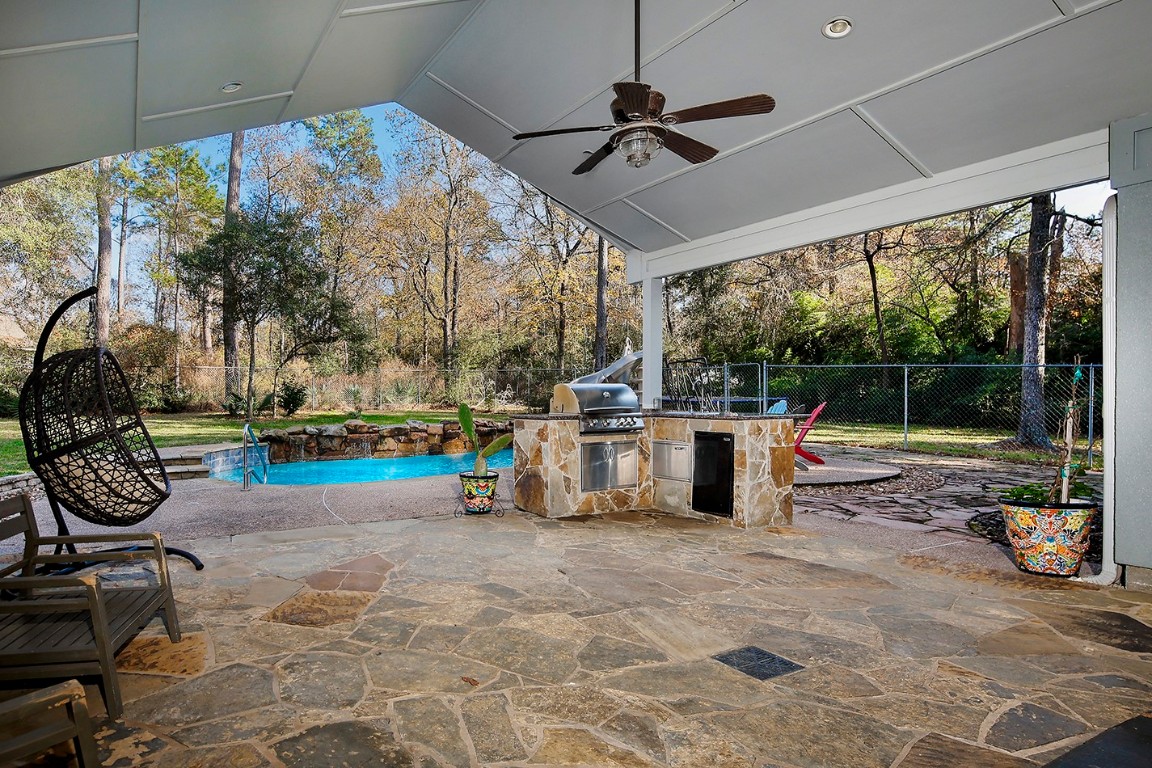 44 Lake Forest Circle Conroe, TX 77384 - Photo 32 of 49 a view of a porch with furniture and garden