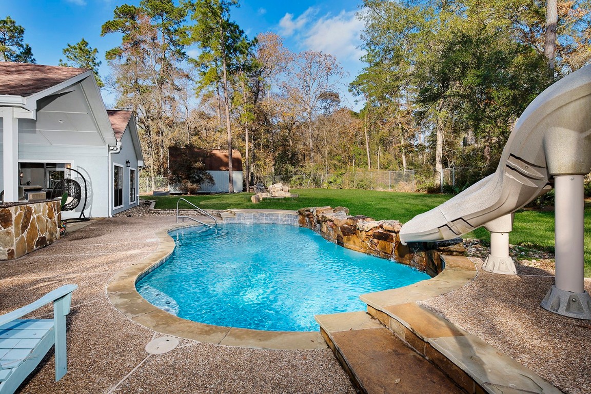 44 Lake Forest Circle Conroe, TX 77384 - Photo 35 of 49 a view of a backyard with sitting area