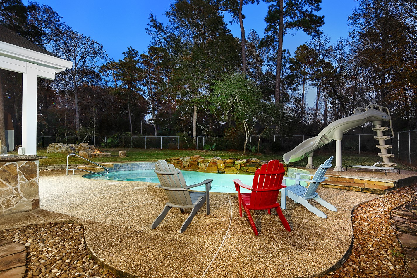 44 Lake Forest Circle Conroe, TX 77384 - Photo 45 of 49 a view of swimming pool with sitting area and garden