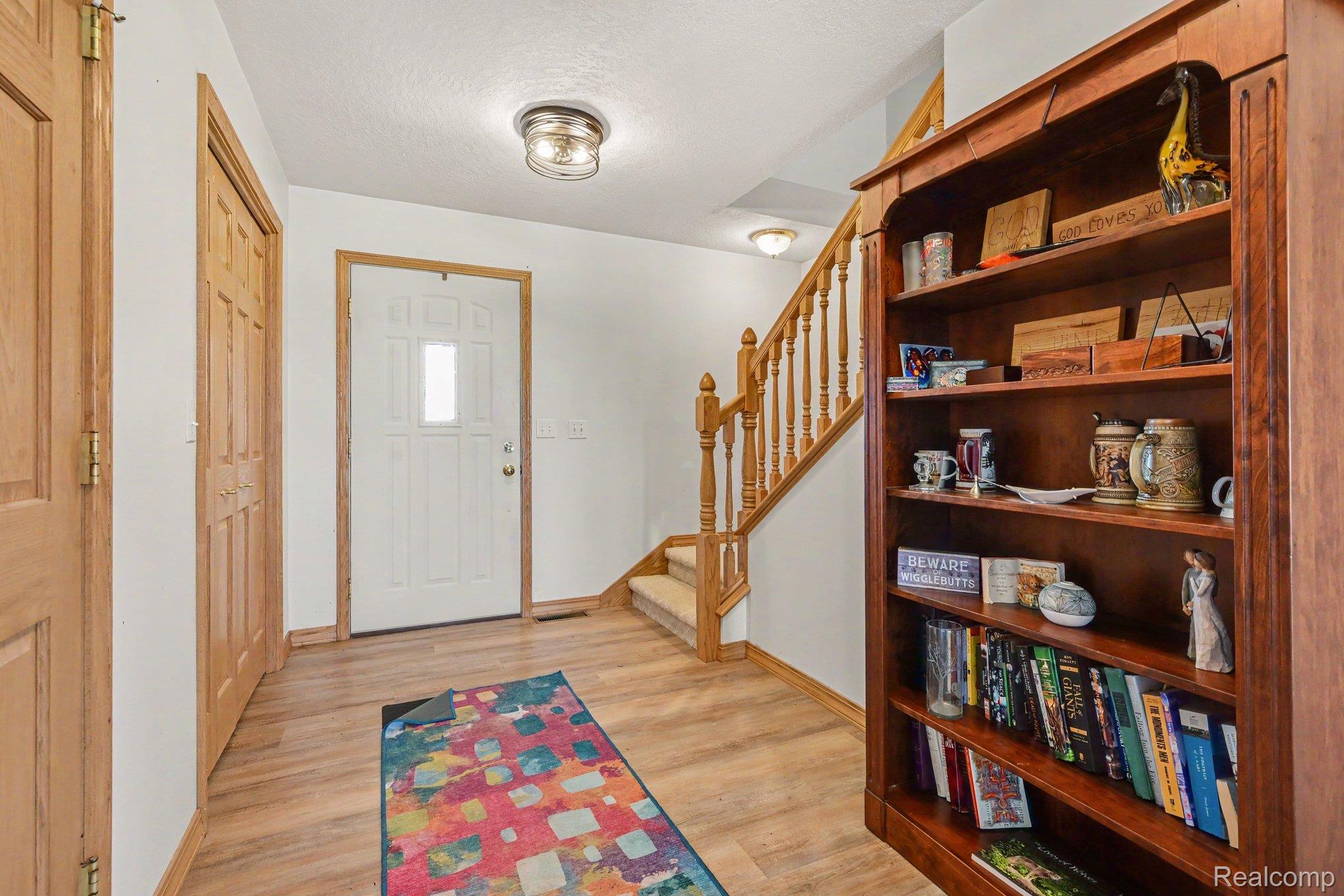 996 Arbogast Road Union City, MI 49094 - Photo 5 of 34 Entryway featuring wood-finish flooring and a white paneled front door with a window insert