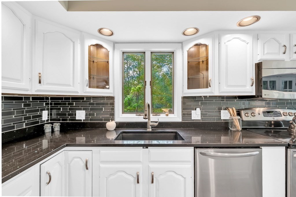 516 Old Wales Road Monson, MA 01057 - Photo 1 of 36 a kitchen with stainless steel appliances granite countertop a sink a stove and cabinets