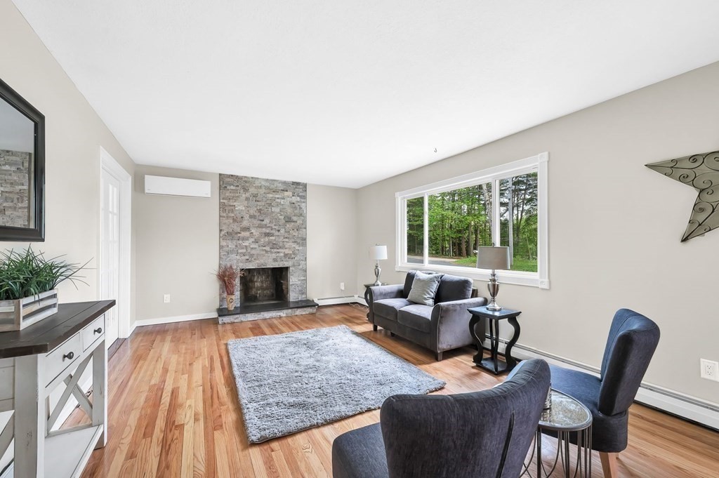 516 Old Wales Road Monson, MA 01057 - Photo 13 of 36 a living room with furniture and a fireplace