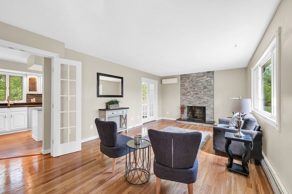 516 Old Wales Road Monson, MA 01057 - Photo 15 of 36 a living room with furniture a fireplace and a table