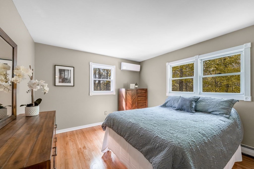 516 Old Wales Road Monson, MA 01057 - Photo 23 of 36 a bedroom with a large bed and a window