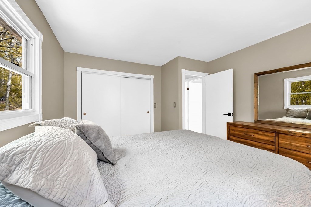516 Old Wales Road Monson, MA 01057 - Photo 24 of 36 a bedroom with a bed and a large window