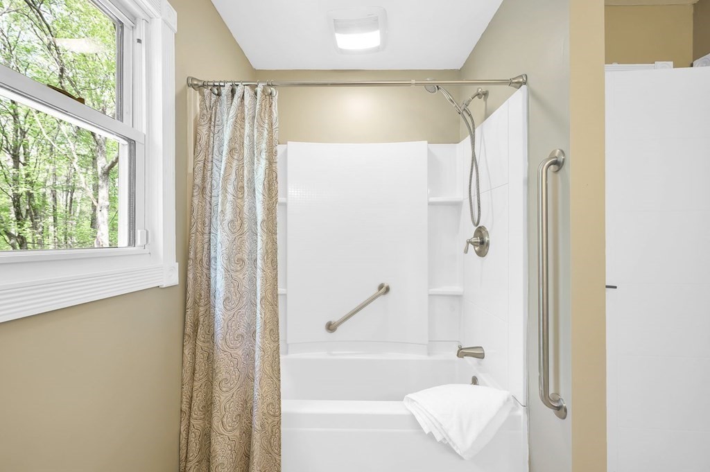 516 Old Wales Road Monson, MA 01057 - Photo 26 of 36 a bathroom that has a glass shower door