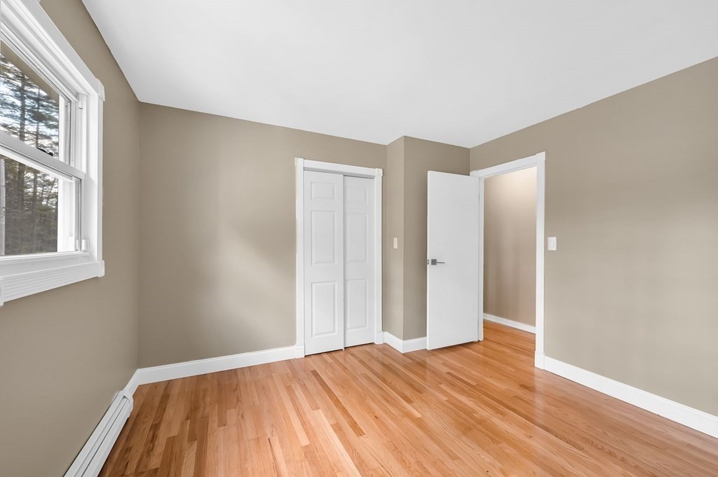 516 Old Wales Road Monson, MA 01057 - Photo 27 of 36 a view of empty room with wooden floor and fan