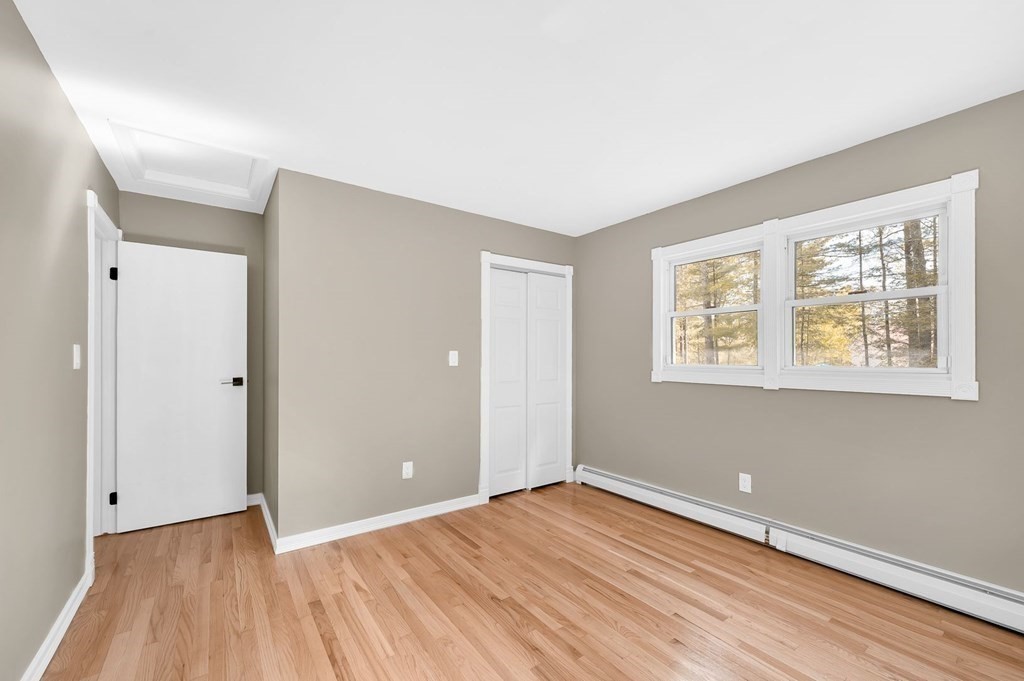 516 Old Wales Road Monson, MA 01057 - Photo 29 of 36 a view of an empty room with wooden floor and a window