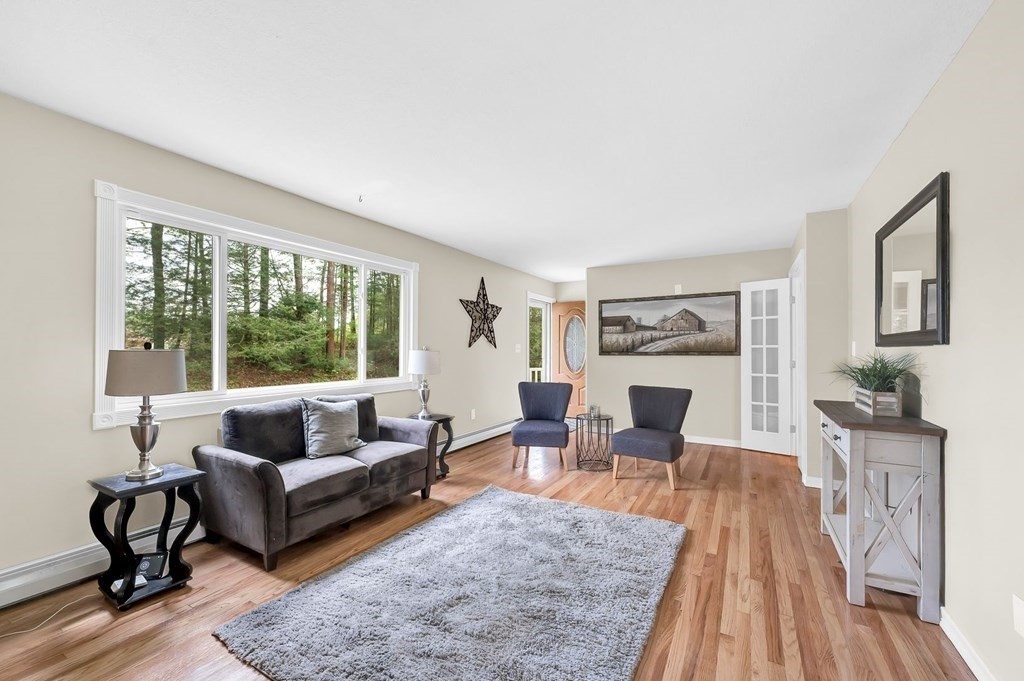 516 Old Wales Road Monson, MA 01057 - Photo 3 of 36 a living room with furniture and a fireplace