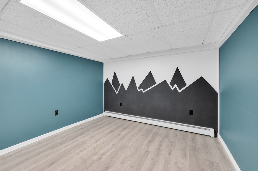 516 Old Wales Road Monson, MA 01057 - Photo 34 of 36 a view of a big room with wooden floor